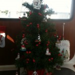 A MERRY CHRISTMAS ON WHITE SWAN (Note the Optometrist Santa)